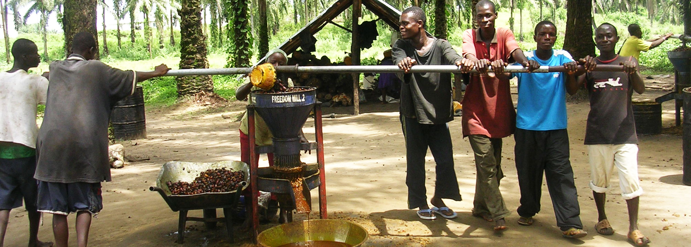 Liberian men at a food mill