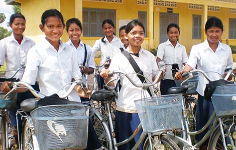 A group of young girls on bicycles