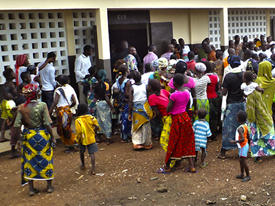 A crowd gathers around a school in Côte d’Ivoire.