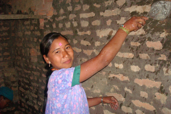 After years of servitude, Ram Kumari Chaudhary enjoys her job as a mason, which brings income and empowerment.