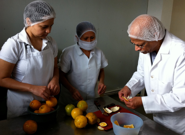 Volunteer Ramana Govin provides food process training to Salvadorian small business 