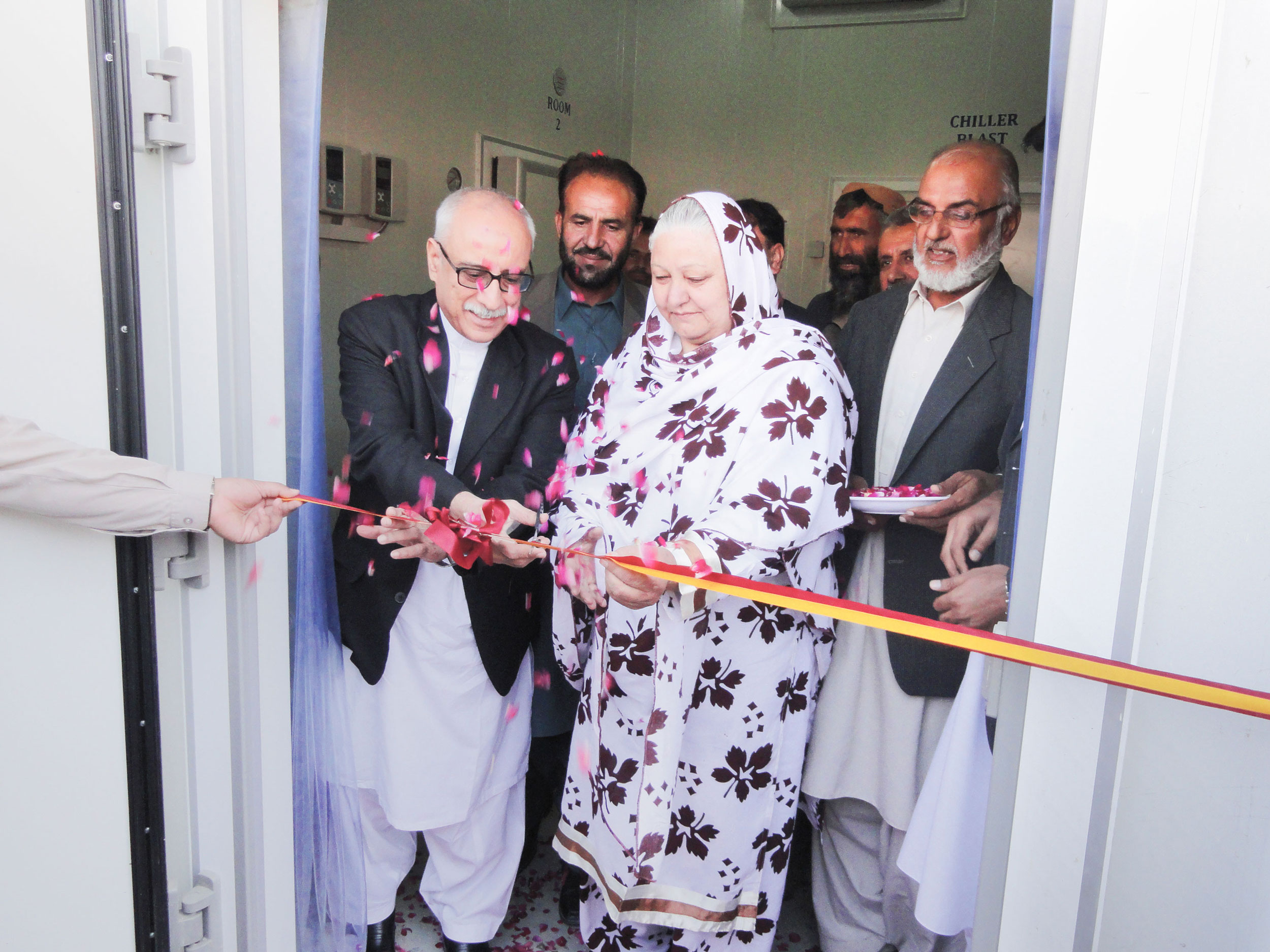 Safina Bibi, center, owns the first-ever modern cold storage facility in Pakistan’s Balochistan Province.